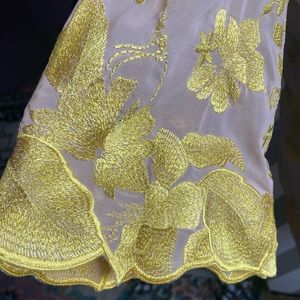 Nude and yellow dress the population dress. Never worn still has tag on it.